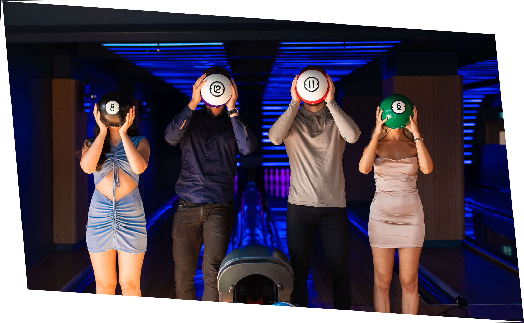 Guests posing with bowling balls in front of their faces @ VEGA Glasgow