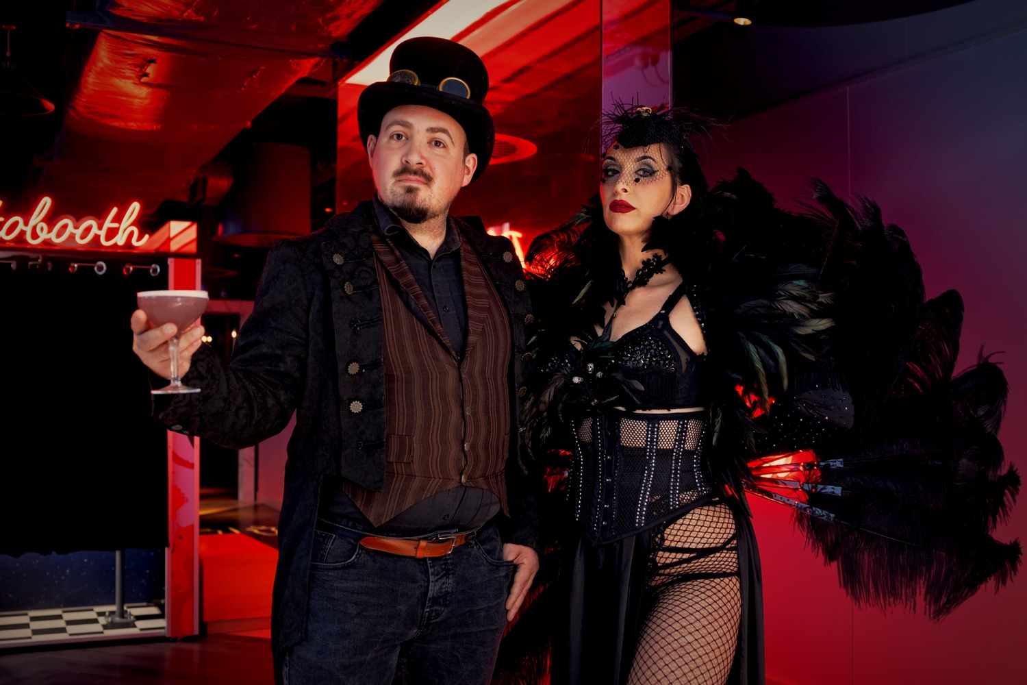 Two guests in gothic Halloween costumes holding a cocktail at VEGA Glasgow